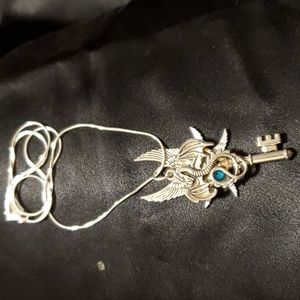 Necklace. Silver Dragon and Key with blue semi-precious stone, on silver chain.